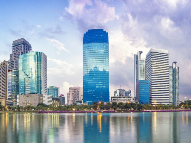 Panorama of Bangkok city downtown at night with reflection of skyline, Bangkok,Thailand
